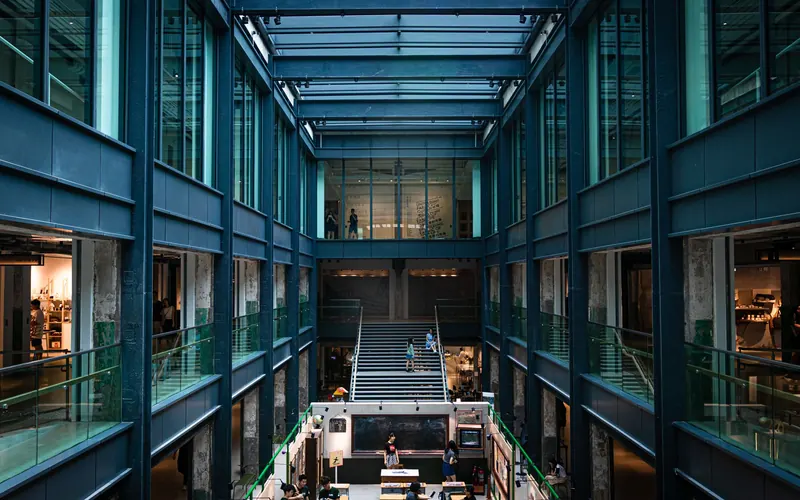 Multi-level shopping mall atrium in Hong Kong with a glass roof